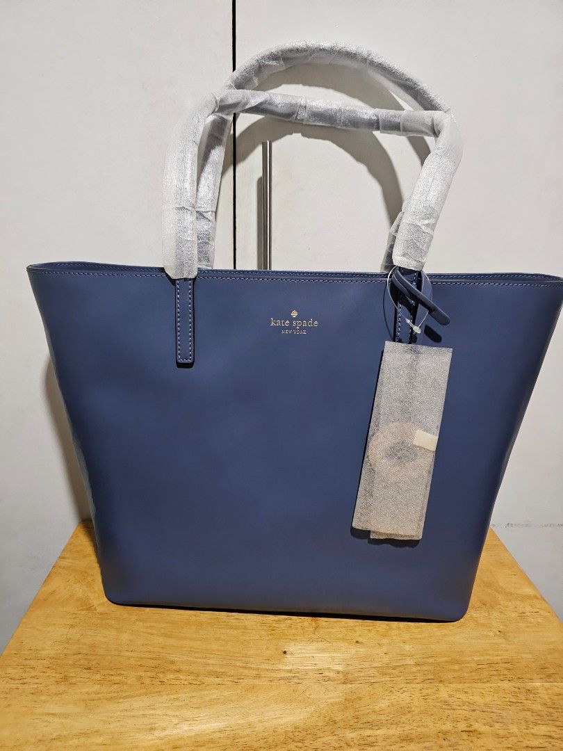 Repriced! Kate Spade Tote Bag (Category: Tote Bags) located in Pasig City. Submitted by rokels_locker (Listing ID 272937198, Image 2). Description: Kate Spade Tanya Medium tote Zipper closure one zipper pocket, two slip pockets smooth leather exterior; two way spade jacquard lining foil embossed logo SIZE: 12"h x 13.2"w x 5.3"d; drop length: 9".