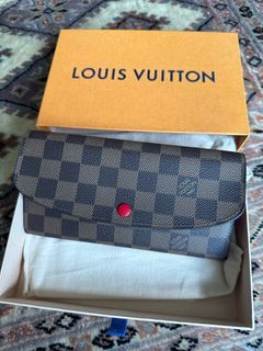 Wear and Tear  One Year Old Louis Vuitton Emilie Wallet in Fuchsia 