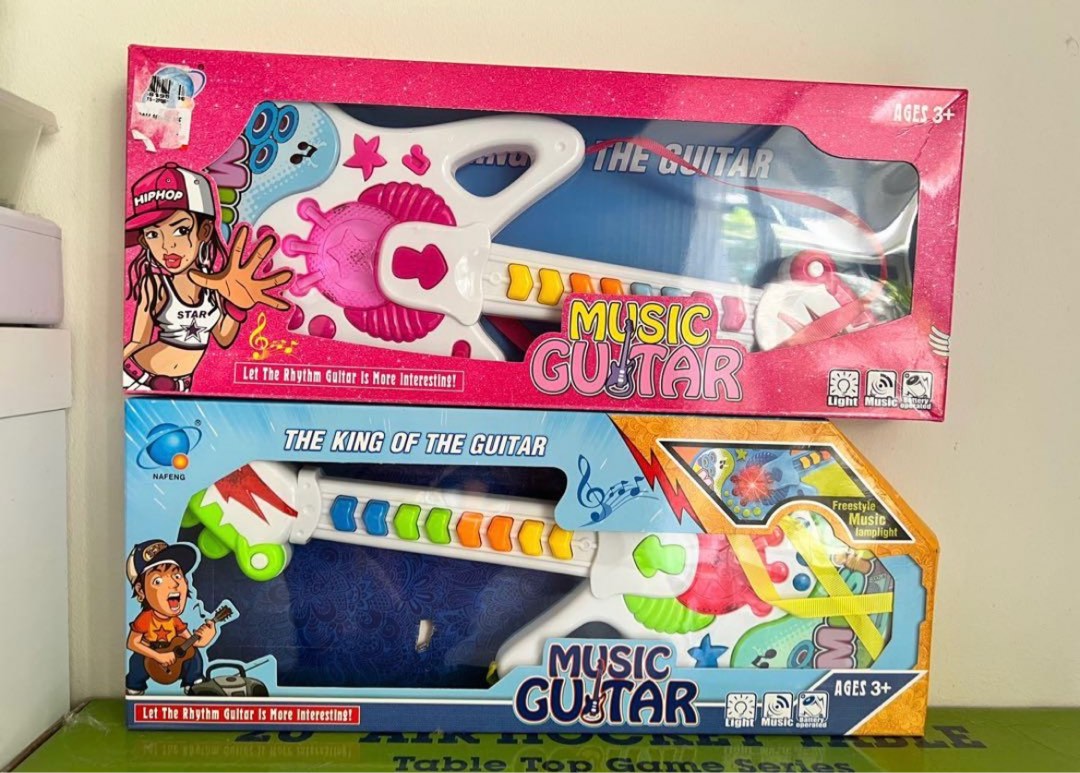 Toy music guitars, Hobbies & Toys, Toys & Games on Carousell