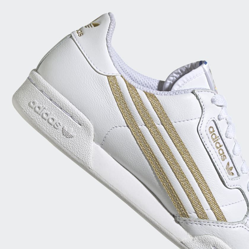 White adidas trainers 2024 with gold stripes
