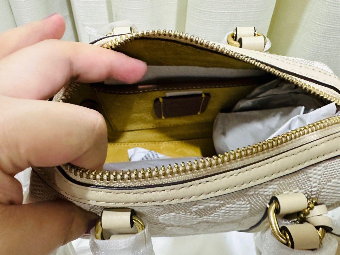 Authentic Coach Ruby 18 Signature Jacquard (Category: Luxury Bags & Wallets) located in Quezon City. Submitted by selinabu (Listing ID 1255579175, Image 3). Description: Brand new and still factory wrapped Can be carried as a handbag or use the long strap as crossbody It may look like a cutie but it will fit all essentials (short wallet, iphone, keys, hand cream, lipbalm, baby wipes, small pack of tissue, mint and keys) it’s quite compact! Super 