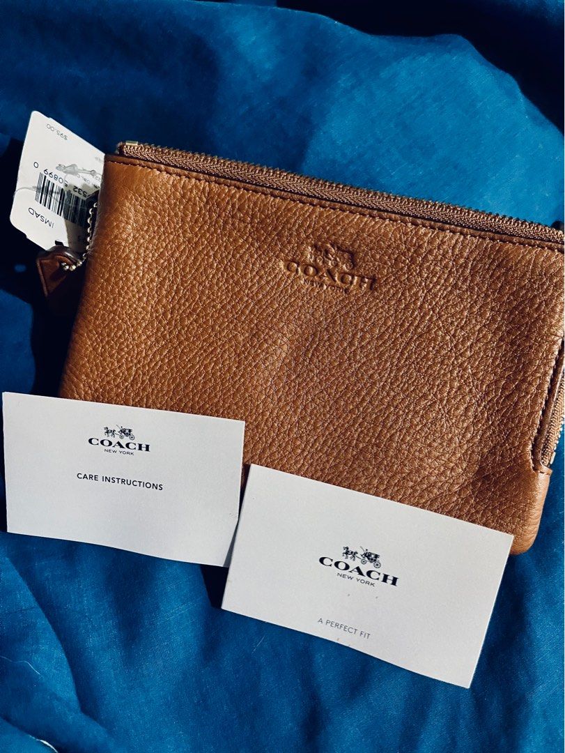 Coach F6605 Leather Wristlet Pouch (Category: Luxury Bags & Wallets) located in Pasig City. Submitted by lollybee (Listing ID 1255383592, Image 2). Description: -Authentic and brand new never used -Selling low due to some minor flaws from storage -Saddle color -With tags.