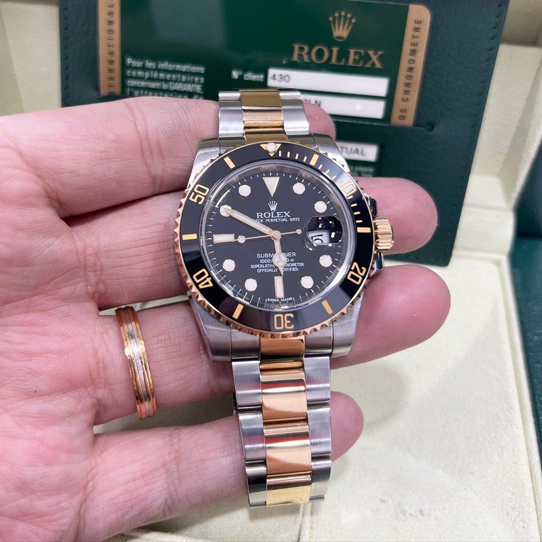 Rolex black and gold submariner top
