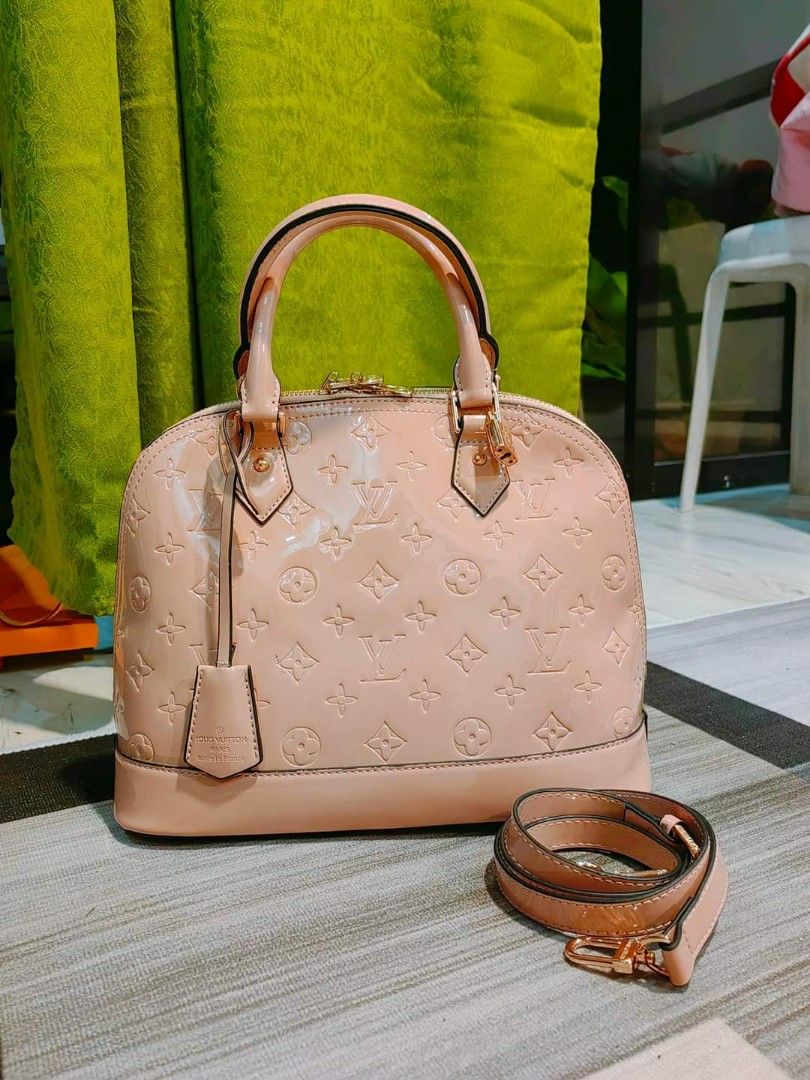 Preloved Lv Alma Patent bag (Category: Luxury Bags & Wallets) located in Cebu City. Submitted by day.98 (Listing ID 1255575714, Image 2). Description: from USA patent leather 30 cm two-way bag no flaws.