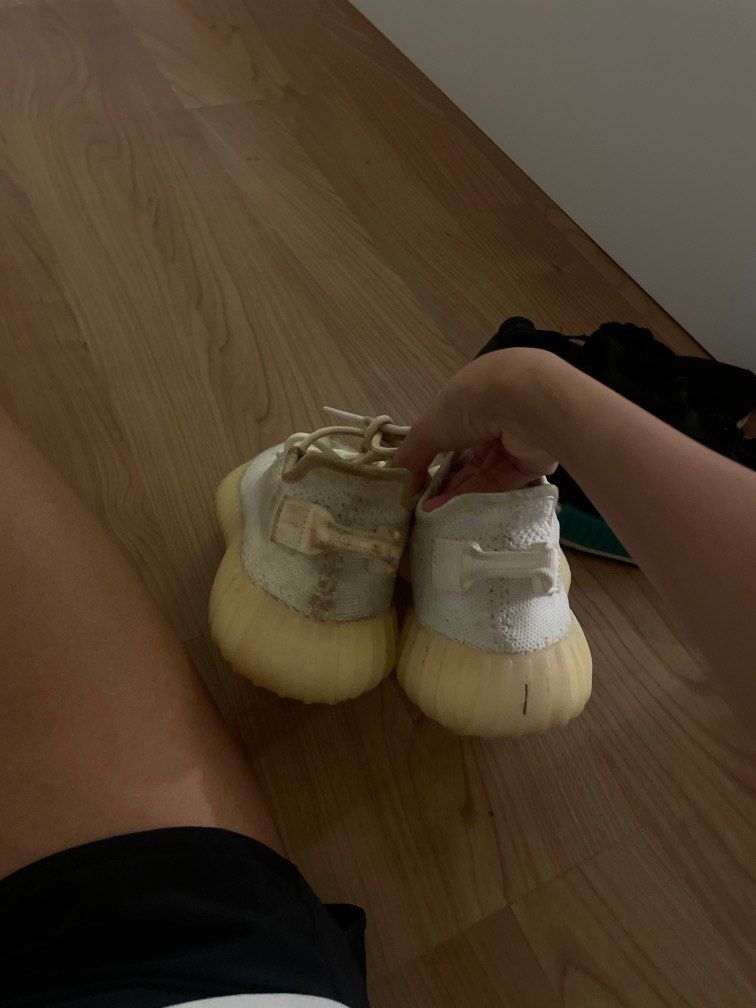 Yeezy cream white on sale feet