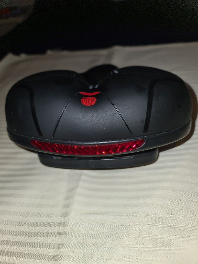Bicycle seat (Category: Bicycles) located in Makati City. Submitted by harvesting_game (Listing ID 1252501060, Image 2). Description: Replacement bicycle seat for mountain bike, e-bike, etc. -Ergonomic -Memory Foam comfort seat - has red Safety lens strip for better visibility -dual spring and hollow breathable design - Universal bike seat rail clamp -waterproof -20cm W 25cm L perfect replacement seat..great for longer and more comfortable rides!