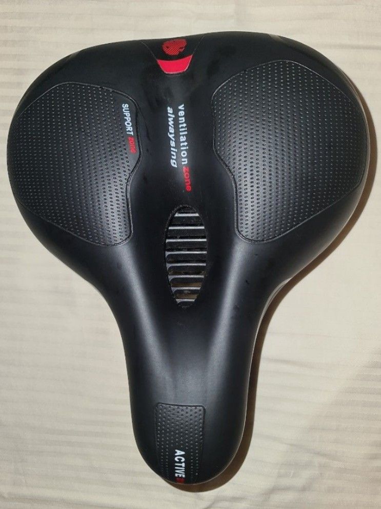 Bicycle seat (Category: Bicycles) located in Makati City. Submitted by harvesting_game (Listing ID 1252501060, Image 1). Description: Replacement bicycle seat for mountain bike, e-bike, etc. -Ergonomic -Memory Foam comfort seat - has red Safety lens strip for better visibility -dual spring and hollow breathable design - Universal bike seat rail clamp -waterproof -20cm W 25cm L perfect replacement seat..great for longer and more comfortable rides!