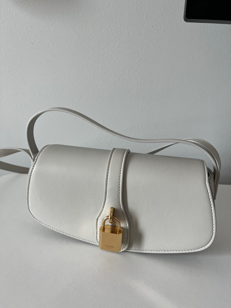 CLUTCH ON STRAP TABOU IN SMOOTH CALFSKIN - ICE BLUE