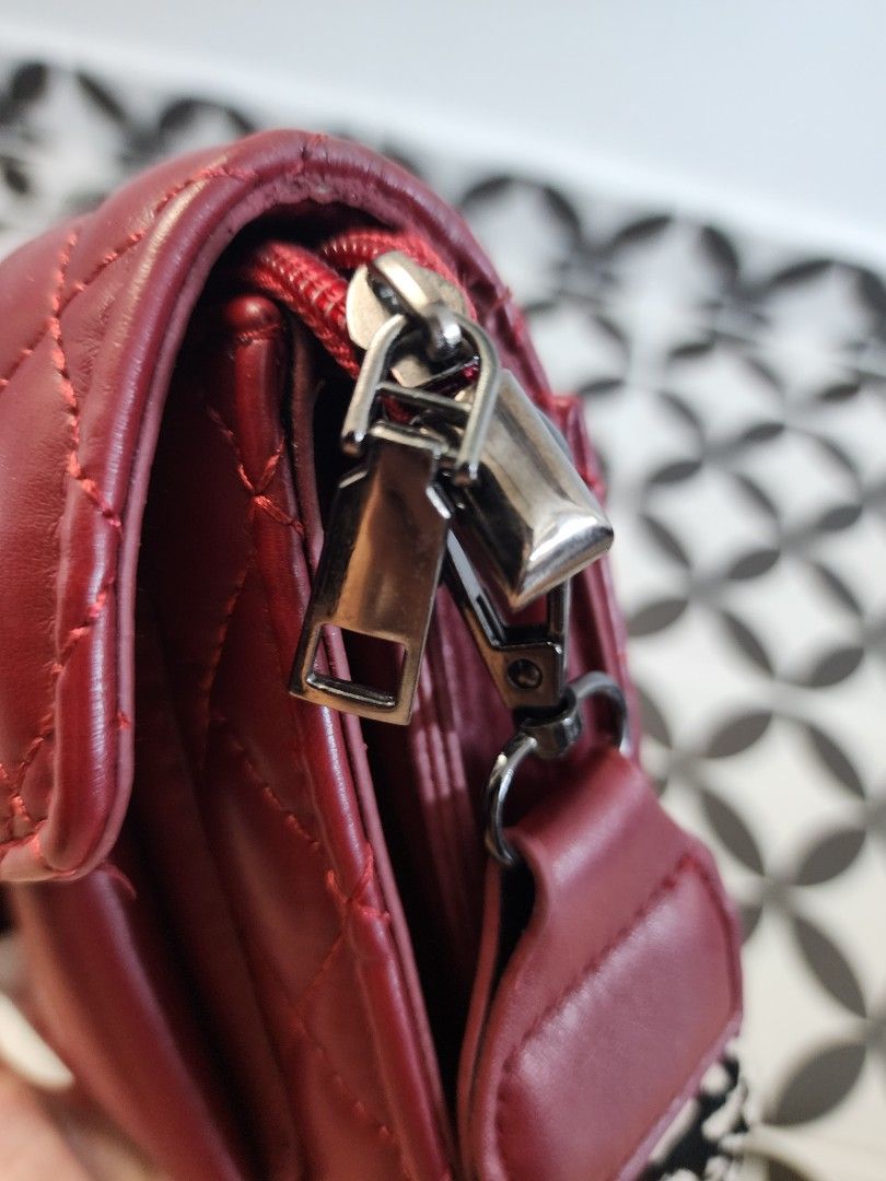 Maroon top sling bag