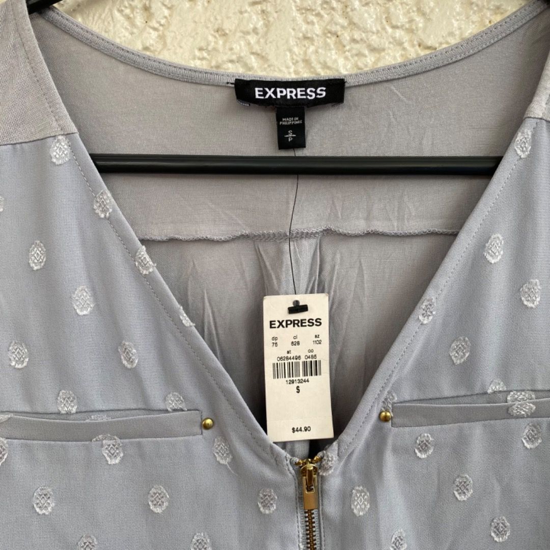 Express Gray Sleeveless Top Blouse Shirt (Category: Sleeveless) located in Cainta. Submitted by paintsoil (Listing ID 1255823460, Image 3). Description: Express Gray Sleeveless Top Blouse Shirt - Brand new with tag - Authentic Express Blouse - Size: Small on tag - Price: ₱400.