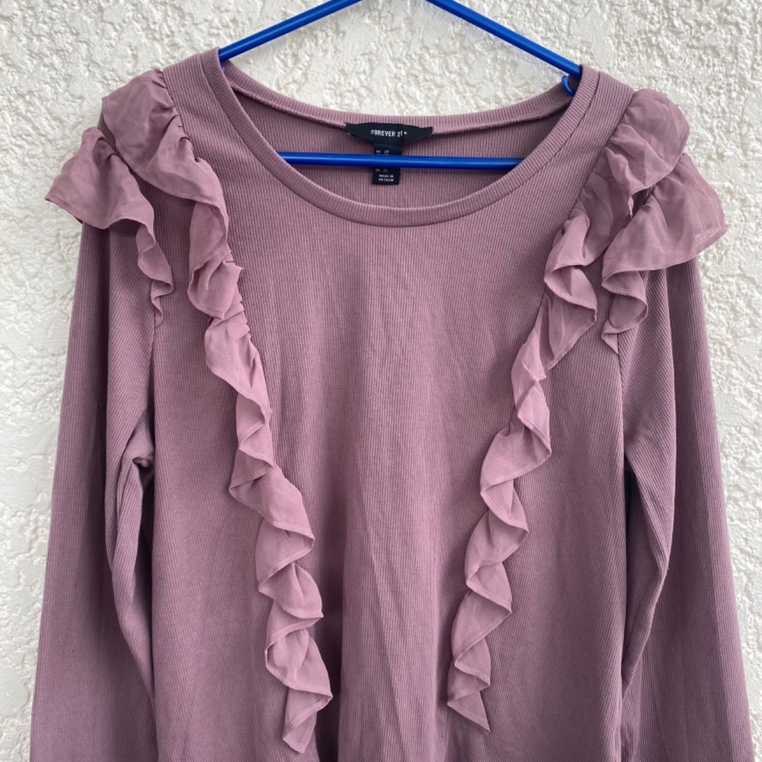 Forever 21 Purple Ruffled Longsleeve Shirt (Category: Longsleeves) located in Cainta. Submitted by paintsoil (Listing ID 1255815331, Image 2). Description: Forever 21 Purple Ruffled Longsleeve Shirt - Used but still in a great condition - Size: Medium on tag - Price: ₱200.