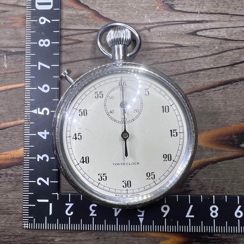 Japan Surplus Tokyo Clock Stopwatch with visible scratches and rust on