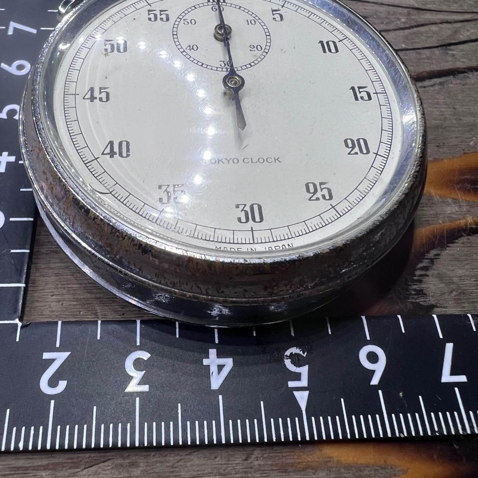 Japan Surplus Tokyo Clock Stopwatch with visible scratches and rust on