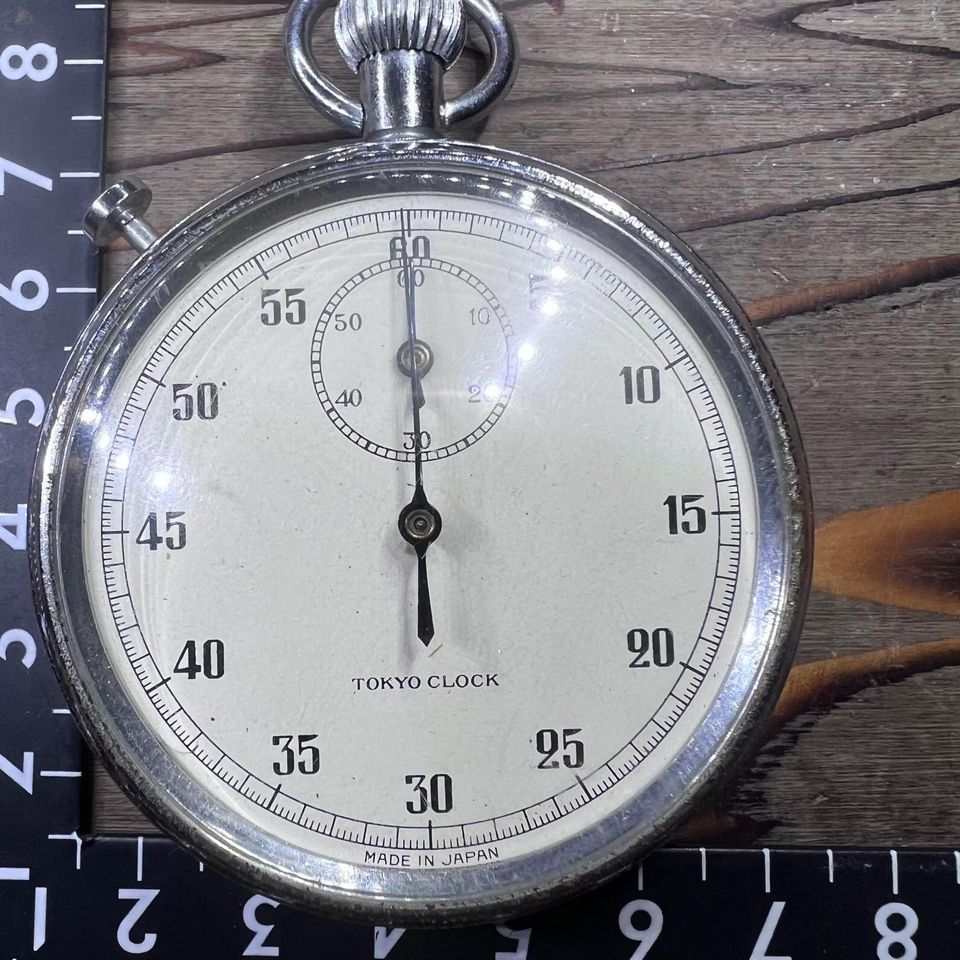 Japan Surplus Tokyo Clock Stopwatch with visible scratches and rust on