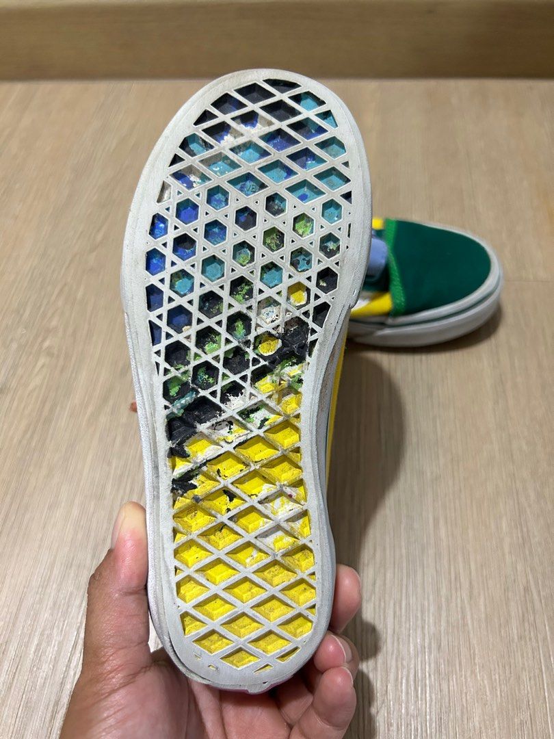 White vans with rainbow on the bottom store
