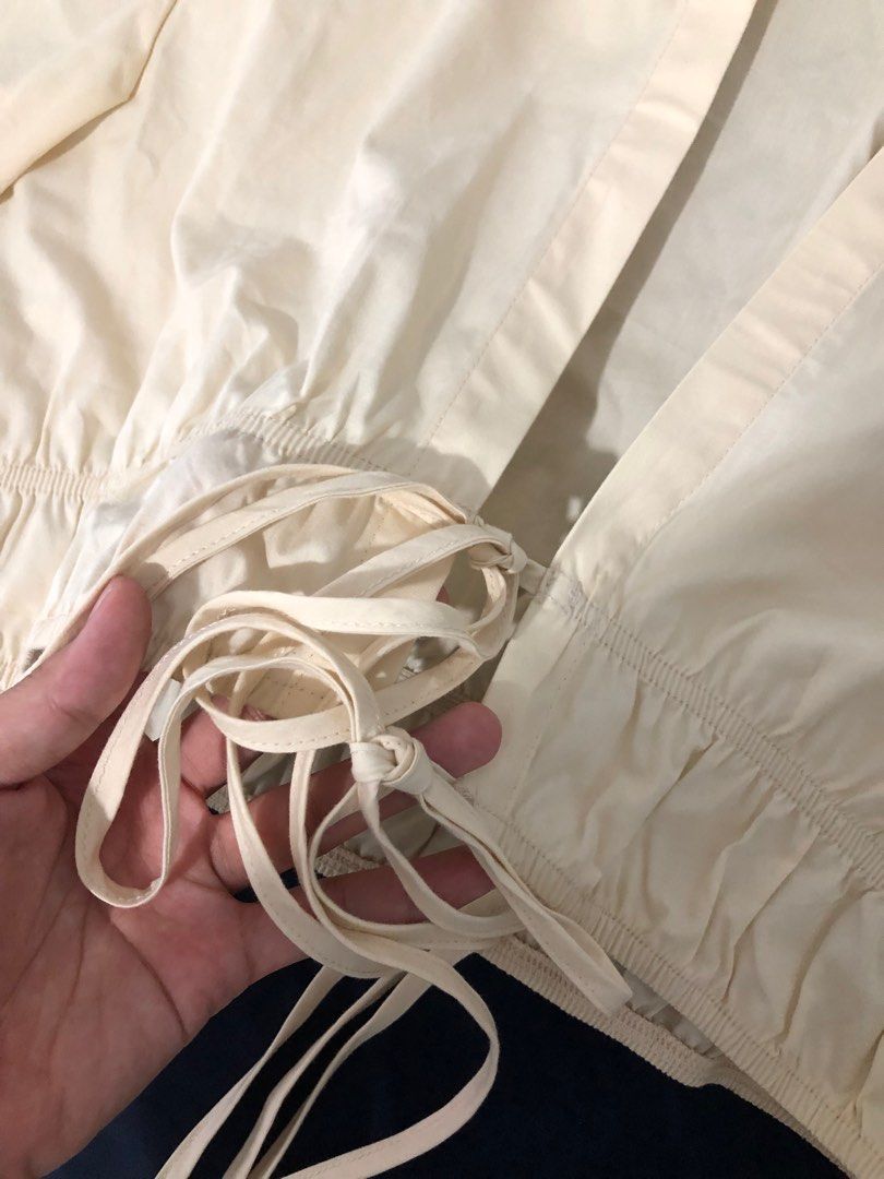 July 7th Beige Beach Front Tie Crop Top (Category: Blouses) located in Manila. Submitted by adnb__ (Listing ID 1256057770, Image 3). Description: • last price listed / selling the same price i got it • worn once to fit • can fit xs - m • brand / top is from thailand • similar to the popular zara dress (last 2 photos are the inspo / captured from former seller’s post) • very cute and light cover, pefect for ph weather • bought it from carousell se