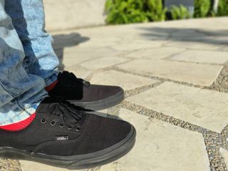 All black discount vans on feet