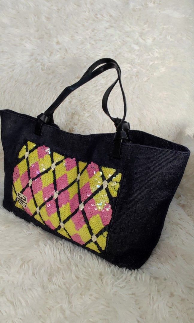 🇯🇵👛 Givenchy Sequinned Denim Bag (Category: Luxury Bags & Wallets) located in Santa Rosa. Submitted by yerbua103 (Listing ID 1256189948, Image 2). Description: 👛 Givenchy sequinned tote bag crafted in denim cloth. exterior has this sequinned design in yellow, pink and white color. On the lower left side is the brand's logo which added accent to the sequinned design in white color. On the sequinned design is an open pocket. It's handle is a 2-