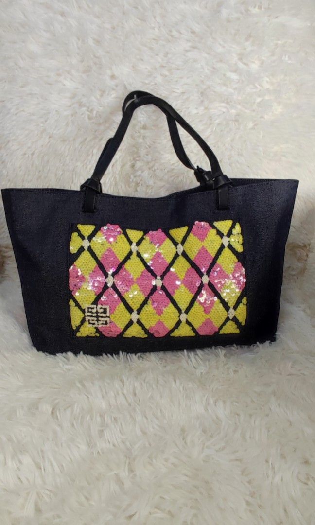 🇯🇵👛 Givenchy Sequinned Denim Bag (Category: Luxury Bags & Wallets) located in Santa Rosa. Submitted by yerbua103 (Listing ID 1256189948, Image 1). Description: 👛 Givenchy sequinned tote bag crafted in denim cloth. exterior has this sequinned design in yellow, pink and white color. On the lower left side is the brand's logo which added accent to the sequinned design in white color. On the sequinned design is an open pocket. It's handle is a 2-
