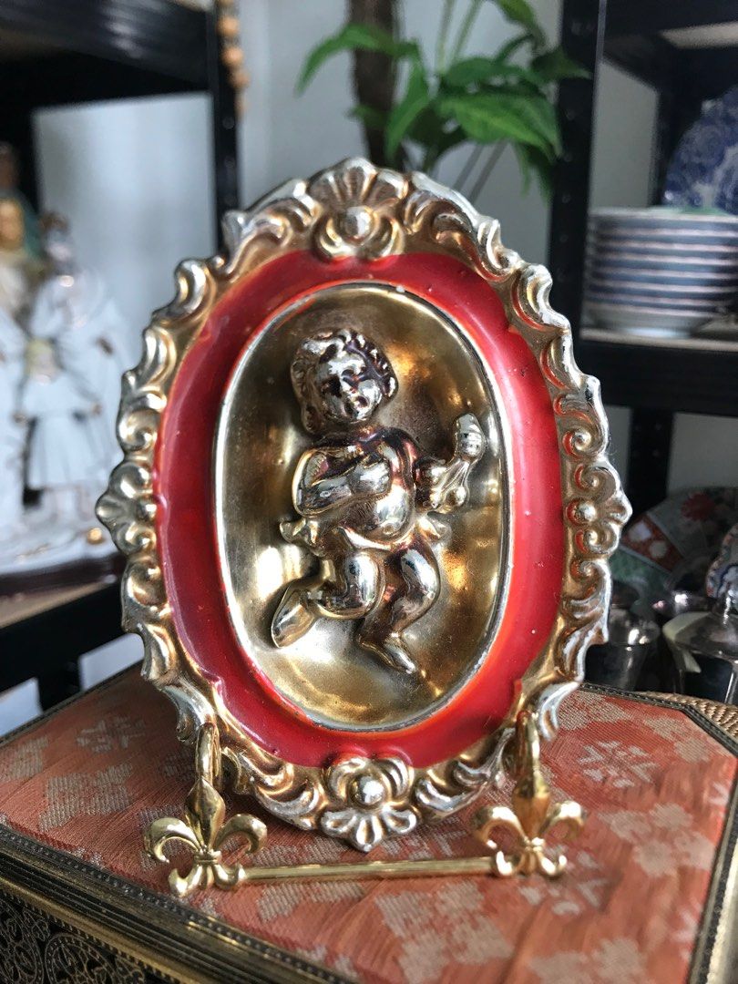 Hollywood Regency Cherub Ceramic Wall Plaque (Category: Wall Decor) located in Bulacan. Submitted by YourCollection (Listing ID 1256125014, Image 1). Description: Hollywood Regency Cherub Ceramic Wall Plaque Measuments H 6” W 4.25” ₱380.