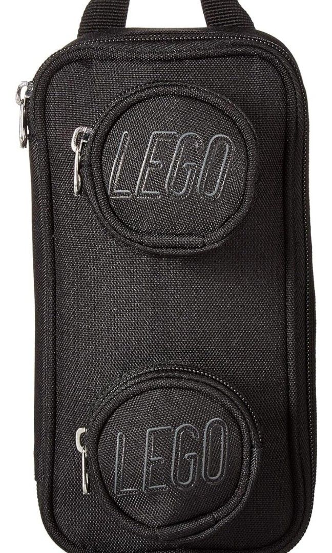 Lego pouch (Category: Purses & Pouches) located in Makati City. Submitted by teamT (Listing ID 1256149538, Image 3). Description: Brand new, sealed, authentic. One black and one green available. Carry your school or office accessories in style with this LEGO® Brick Pouch. Shaped like a classic 1x2 brick, its spacious main compartment and 2 LEGO stud-style zip pockets are ideal for holding pens, pads, tech chargers, flash drives, snacks and more. 