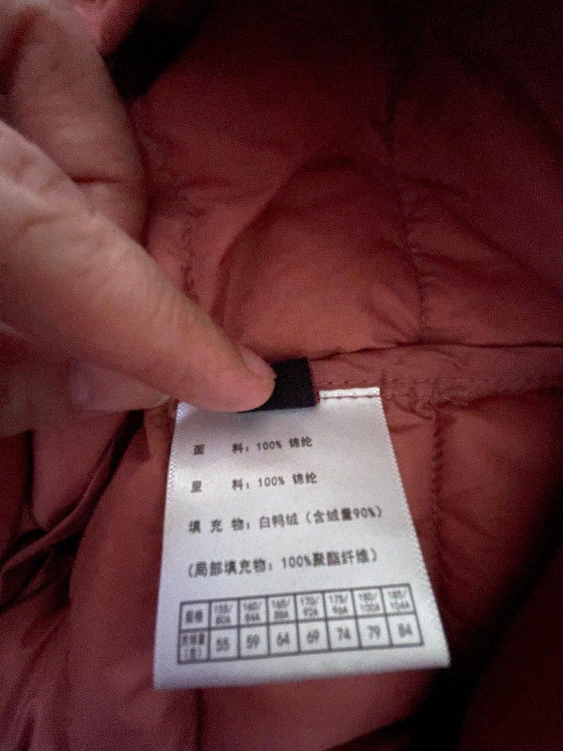 Light down jacket (Category: Babies & Kids Fashion) located in Singapore. Submitted by gc__closet (Listing ID 1256139269, Image 8). Description: Preloved Condition: 8/10 (not for fussy) Ptp: 45cm Length: 56cm Comes with a small little bag to keep the jacket Wear once only Note: 1. Stain at the front and back (refer to picture circled in green ) 2. The drawstring for the bag has some frills. (Refer to picture arrow in green) Top up $2 for normal m