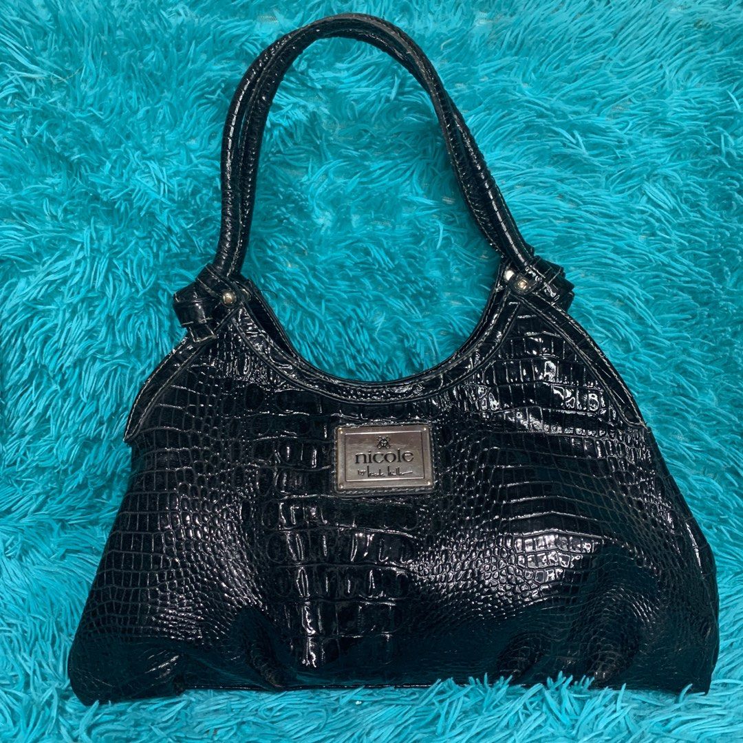 Nicole Miller Black Shoulder bag (Category: Shoulder Bags) located in Meycauayan. Submitted by SaveOnBrand (Listing ID 1256187565, Image 1). Description: Nicole Miller In Mint condition Medium size 📌LOC: Meycauayan, Bulacan 📌MOP: BANK TRANSFER(BPI, BDO, Security Bank) / Gcash / Paymaya 📌COURIER: J&T / LBC / pwede rin COD if lalamove. COP for LBC ❤️R E M I N D E R S 📌 Please manage your expectations. 📌 All items are in good condition, (flaw w
