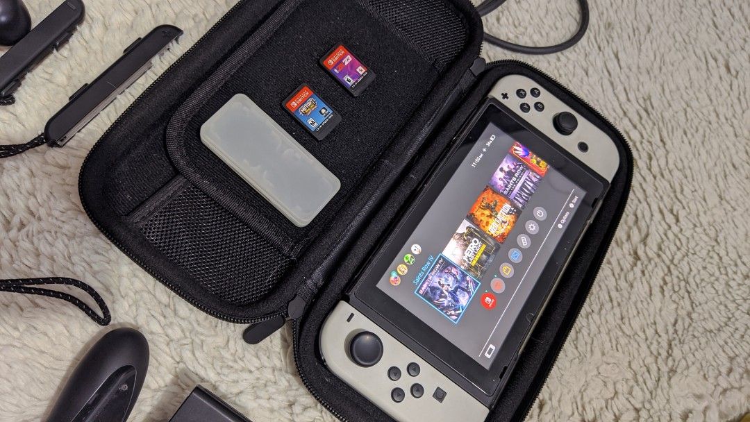 Nintendo Switch v2 with Freebies (Category: Nintendo) located in Malabon City. Submitted by mirajane55 (Listing ID 1256158461, Image 3). Description: Nintendo Switch v2 white joycons w/ freebies Inclusion: > 2 Physical Game Cartridges (Nba 2k23 and Mutant Football League) > Digital Games ( Saints Row 3, Saints Row 4, Red Faction Remarstered and Metro Last Light Redux) > 128 Samsung Evo SD Card > Joycon Grip > Individual Joycon Grip > HDMI cable >
