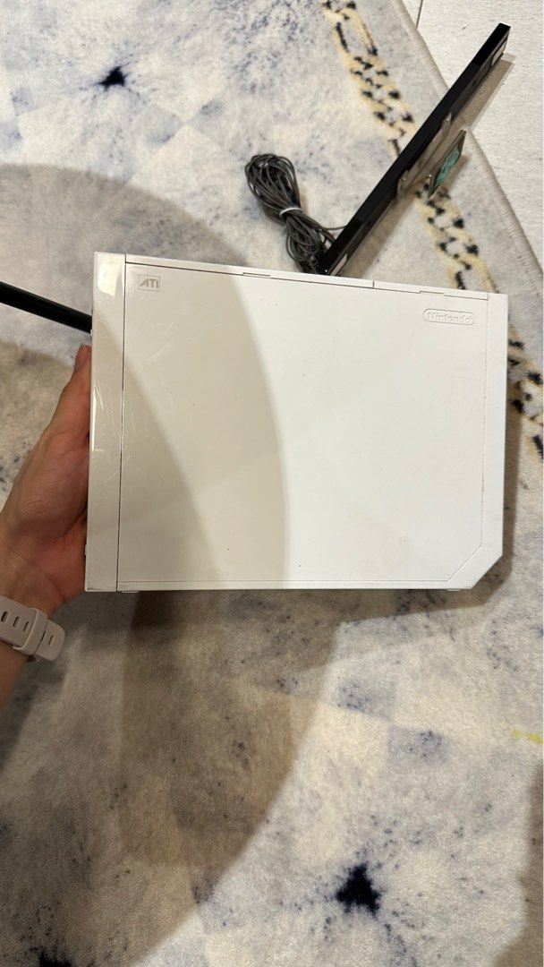 Nintendo Wii complete set (Category: Nintendo) located in Manila. Submitted by alexamc_ (Listing ID 1256114561, Image 2). Description: 2 Remotes with Nunchuck Complete wirings Sensor With games.