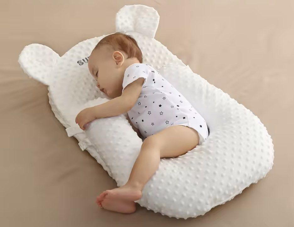 Baby sleeping on cheap u shaped pillow
