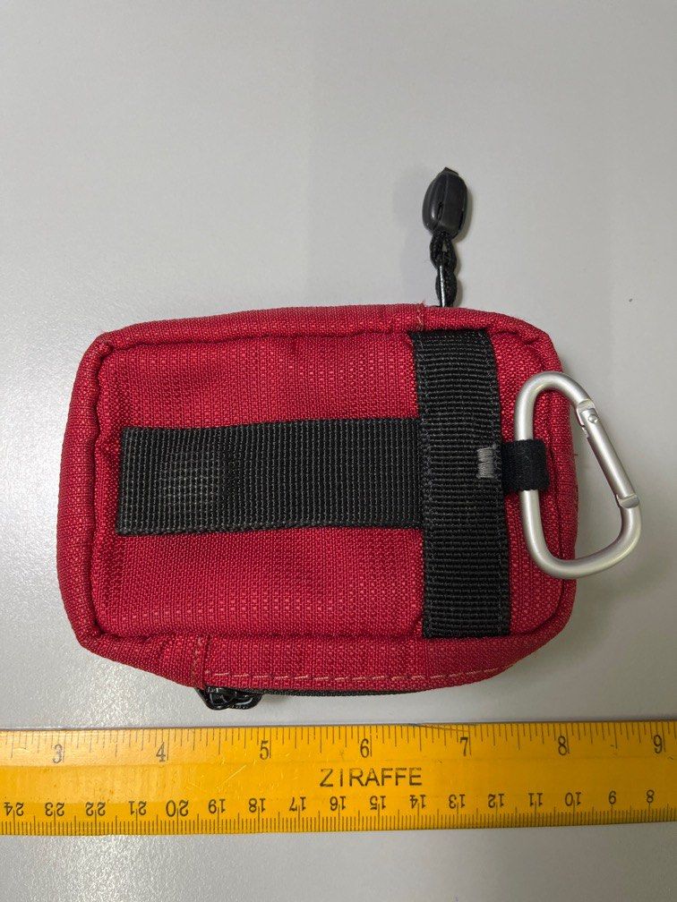 Pouch (Category: Purses & Pouches) located in Ipoh. Submitted by ostracioncubicus (Listing ID 1256210759, Image 3). Description: Brand: The Traveller Colour: Red with black zipper Dimension: L4” W3.5” D0.5” Double zipper compartment x 1 Padded Belt loop Carabiner .