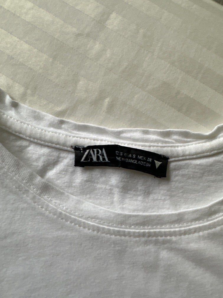 Zara Basic White Tee (Category: Shirts) located in Makati City. Submitted by nisayaptinchay (Listing ID 1256176876, Image 2). Description: Zara Basic White Tee Size: Small (But not fitted).