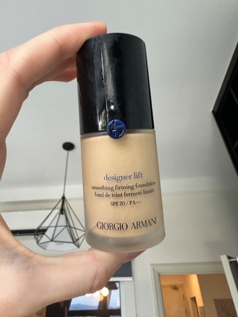 Armani designer sales lift