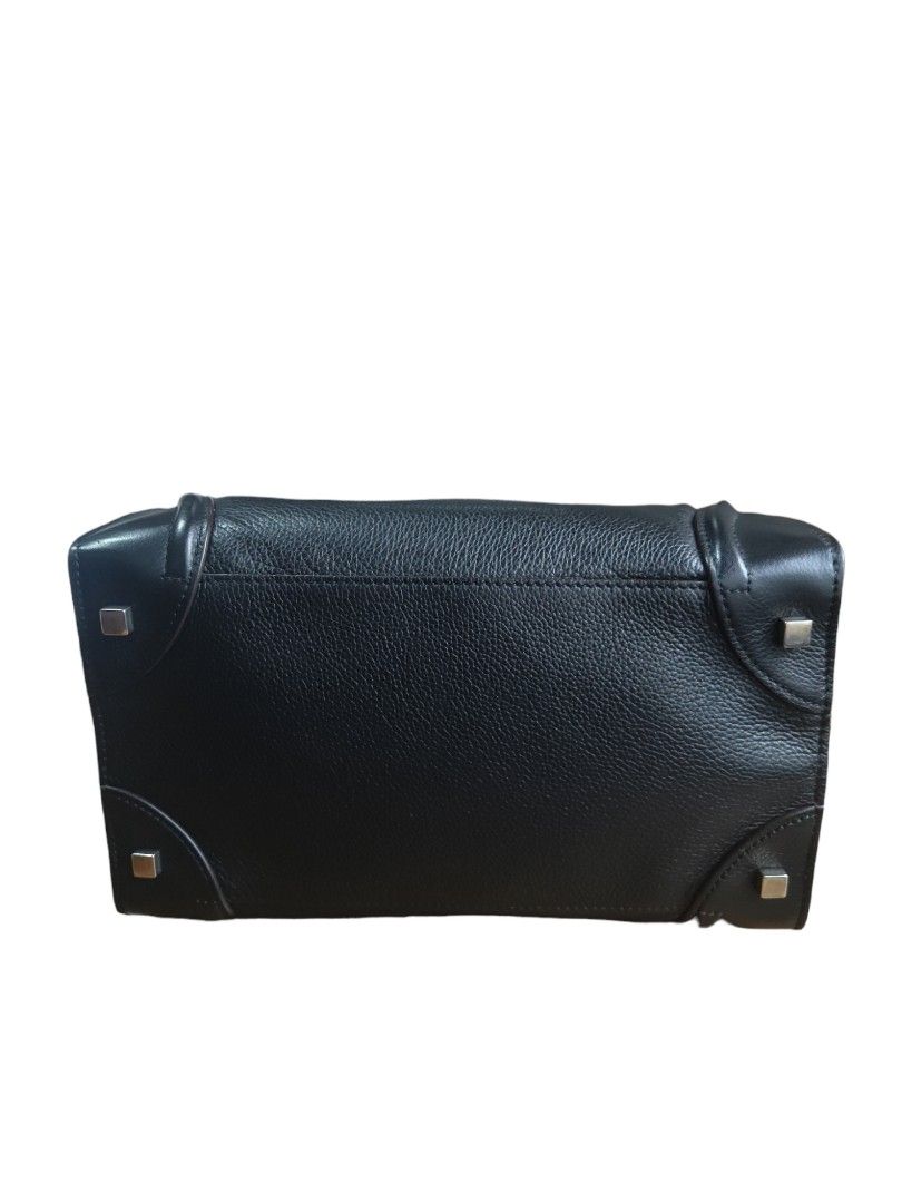 Pre-loved Celine Mini Luggage Tote Back (Black) (Category: Luxury Bags & Wallets) located in Mandaluyong City. Submitted by declutter_dolly (Listing ID 1256437228, Image 3). Description: MINT CONDITION! Preloved bag from Japan Authentic (No fakes in Japan) Bought it from TreFact in Chiba City iPhone XS Max in photo size comparison Dimensions: 30 cm x 30 cm x 17 cm Color: Black Style: Mini Luggage (discontinued) LFS: I'm half Japanese, I bought it