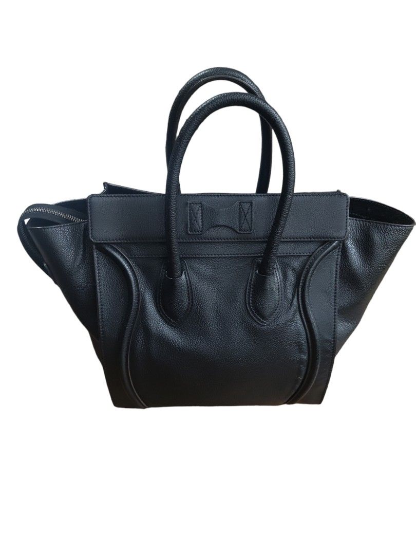 Pre-loved Celine Mini Luggage Tote Back (Black) (Category: Luxury Bags & Wallets) located in Mandaluyong City. Submitted by declutter_dolly (Listing ID 1256437228, Image 2). Description: MINT CONDITION! Preloved bag from Japan Authentic (No fakes in Japan) Bought it from TreFact in Chiba City iPhone XS Max in photo size comparison Dimensions: 30 cm x 30 cm x 17 cm Color: Black Style: Mini Luggage (discontinued) LFS: I'm half Japanese, I bought it