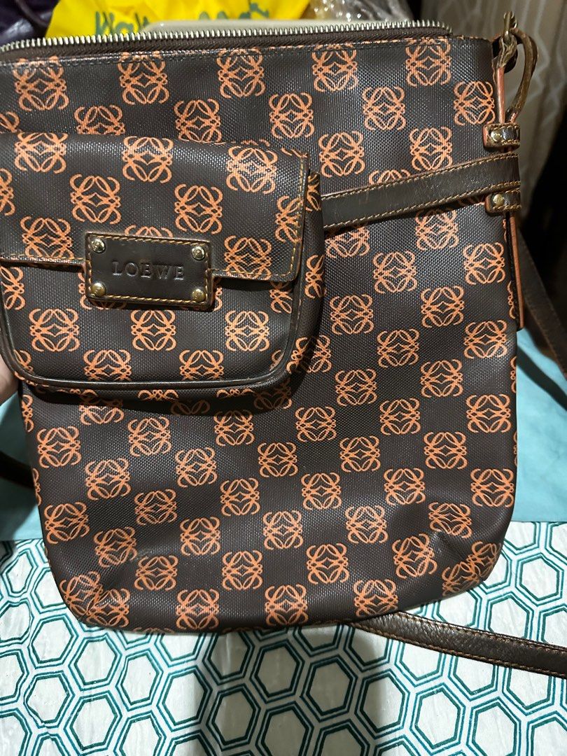 loewe sling vintage bag (Category: Luxury Bags & Wallets) located in Antipolo. Submitted by ambercs (Listing ID 1256311304, Image 1). Description: loewe bag / sling bag loewe anagram canvas bag with pouch vintage with small pouch ( detachable) (some seller sold it seperately) from legit seller in japan in good condition and usable strap: need edging exterior: cleaning, eding and restoration sa both dulo ng bag interior: need ipaayos sa restoratio
