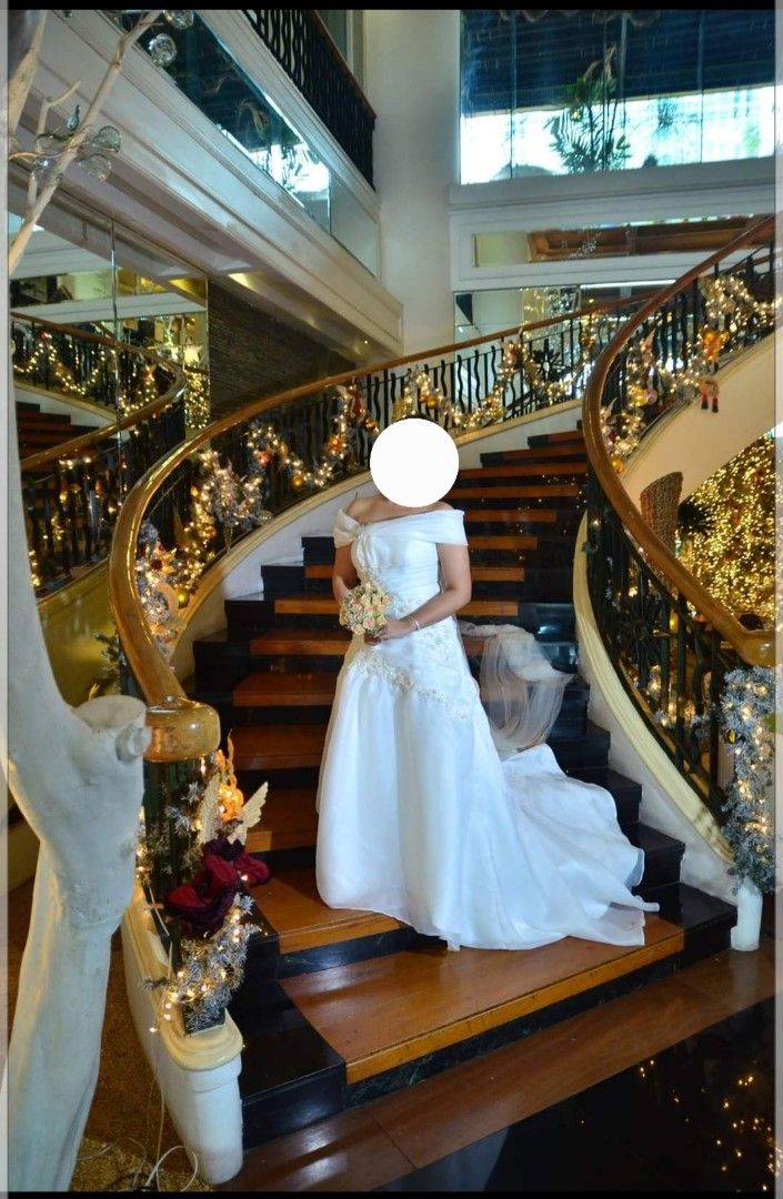Minimalist Wedding Gown (Category: Evening dresses & gowns) located in Bacoor. Submitted by cloudcerine (Listing ID 1256459227, Image 3). Description: Custom made wedding gown. Original price: 30k Used last December 2014. Corset type with built in petticoat and lining. Size: Large to semi XL Stored but with stains please see photos. Was not dry clean. Selling very low to cover the dry clean cost. Slightly negotiable. complete with veil and weddin