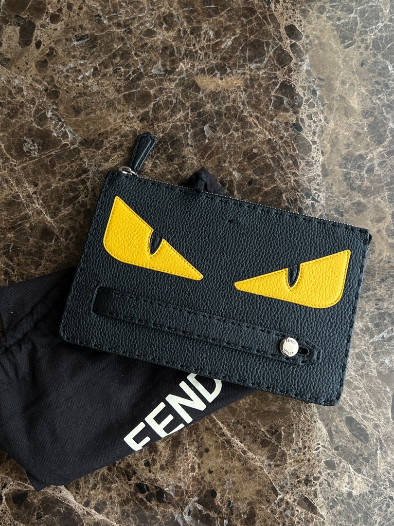 Fendi monster eyes clutch wallet Men s Fashion Bags Belt bags Clutches and Pouches on Carousell