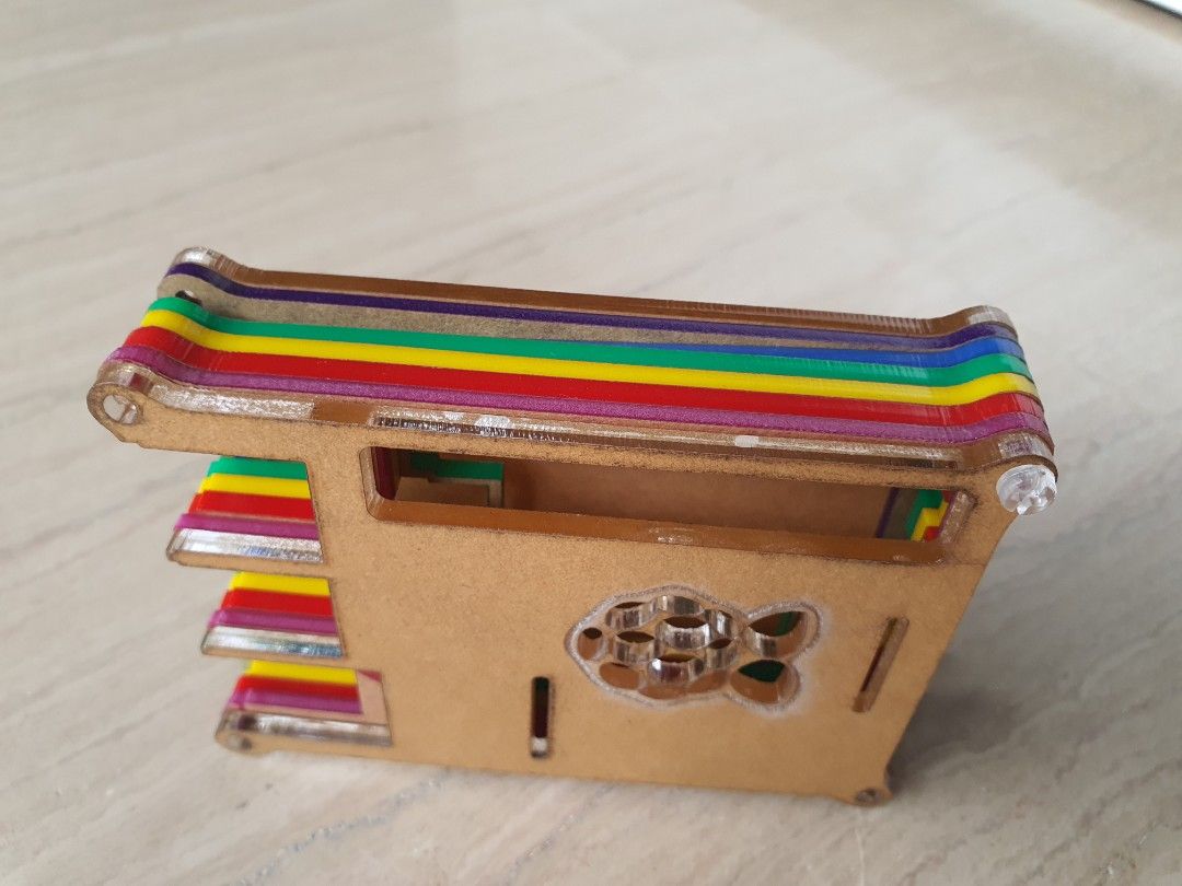 Multicolored Raspberry Pi Case (Category: Other Accessories) located in Singapore. Submitted by manup82 (Listing ID 1256497613, Image 2). Description: Beautiful Multicoloured Raspberry Pi Case with transparent nut and screws. The top and Bottom are transparent. Brown protective film has to be removed..