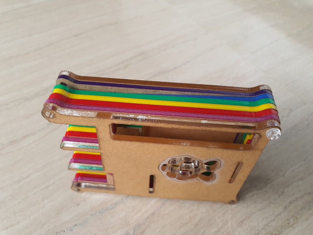 Multicolored Raspberry Pi Case (Category: Other Accessories) located in Singapore. Submitted by manup82 (Listing ID 1256497613, Image 1). Description: Beautiful Multicoloured Raspberry Pi Case with transparent nut and screws. The top and Bottom are transparent. Brown protective film has to be removed..