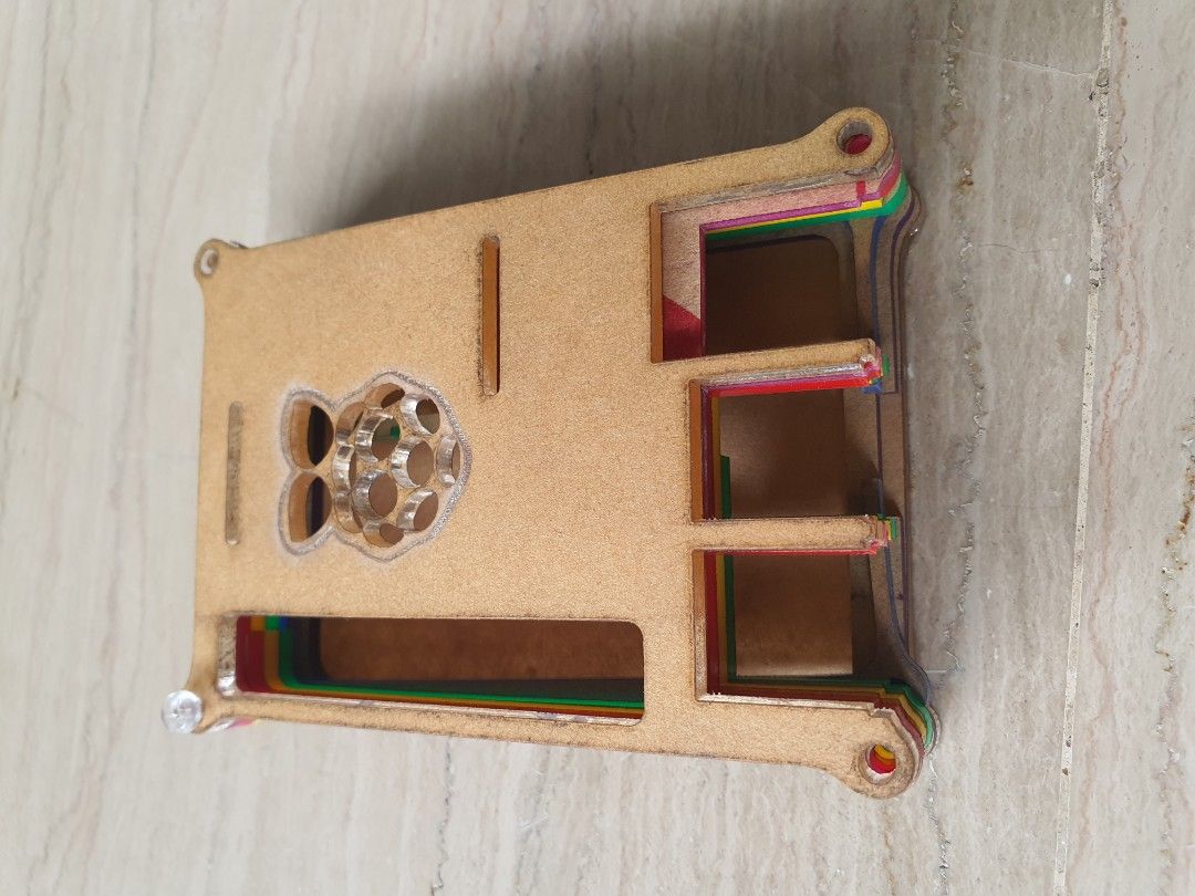Multicolored Raspberry Pi Case (Category: Other Accessories) located in Singapore. Submitted by manup82 (Listing ID 1256497613, Image 3). Description: Beautiful Multicoloured Raspberry Pi Case with transparent nut and screws. The top and Bottom are transparent. Brown protective film has to be removed..