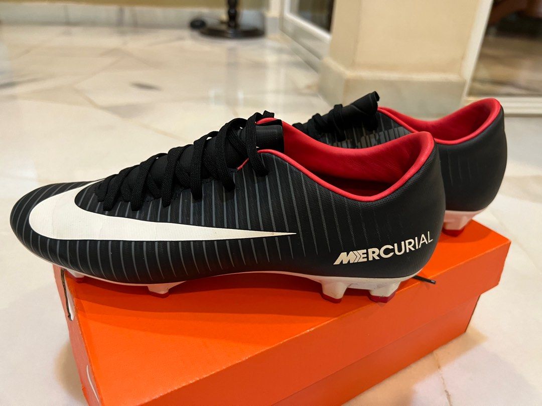 Nike football shoes hotsell black and orange
