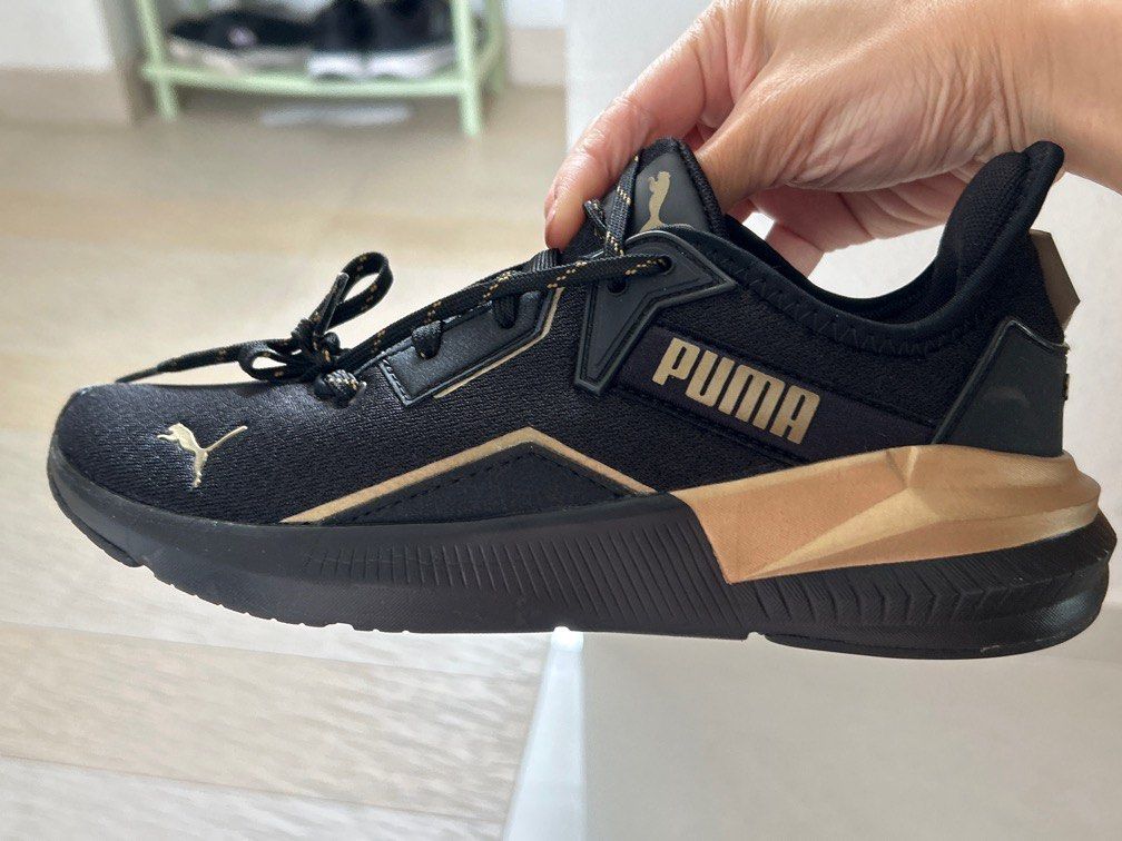 Black and shop gold pumas 6.5