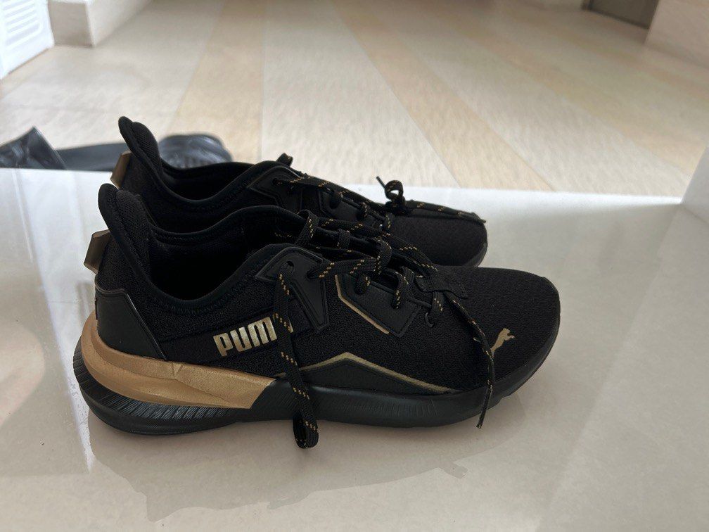 Black and shop gold pumas 6.5