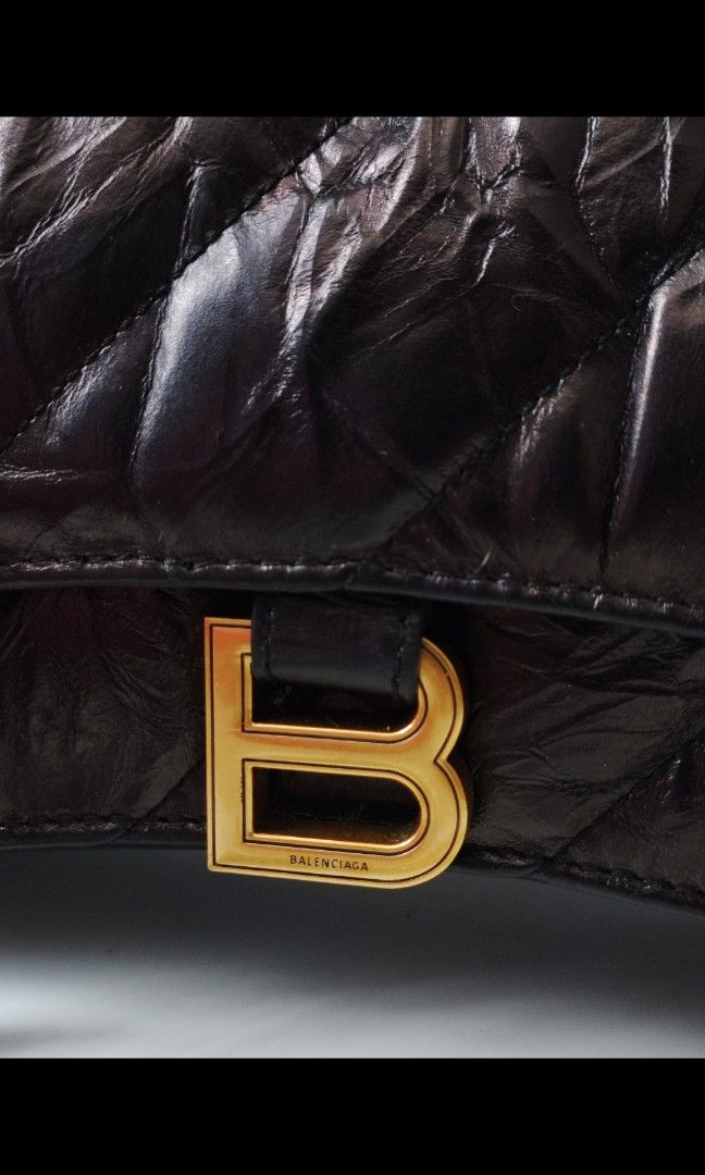 Balenciaga Crush Chain Bag (Category: Luxury Bags & Wallets) located in Santa Rosa. Submitted by sassycollection. (Listing ID 1255761237, Image 3). Description: A quilted bag is one of the easiest ways to add some texture and depth to your look and Balenciaga's Crush small chain bag does not disappoint. Designed with the iconic curvilinear base, this puffy silhouette is crafted from crushed calfskin with diagonal quilted stitching and finished wi