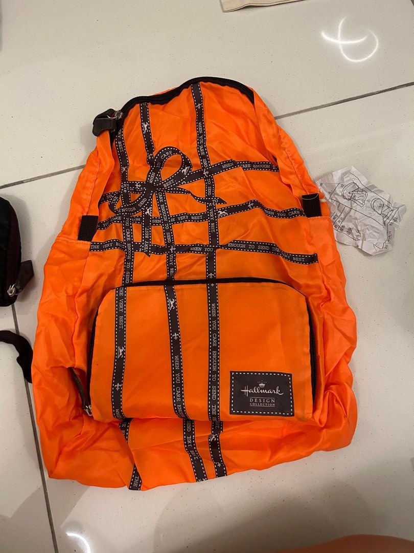 Foldable backpack (Category: Backpacks) located in Johor Bahru. Submitted by amberr257 (Listing ID 1256787562, Image 1). Description: Folded backpack Selling both - black & orange Selling one for rm20 both for rm35 iPad (9.4inch) used as size reference.