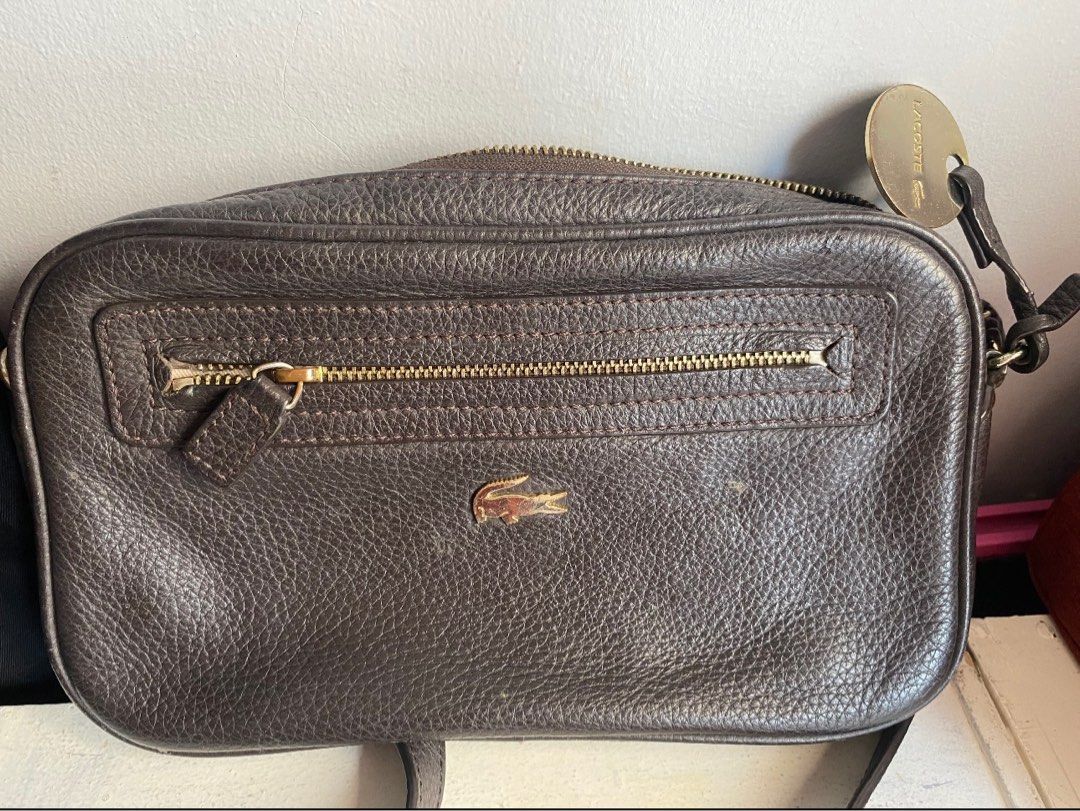 Lacoste Camera Bag (Category: Luxury Bags & Wallets) located in Binangonan. Submitted by joizeeful (Listing ID 1256821969, Image 2). Description: Vintage Genuine leather No major flaw Signs of usage Very presentable and elegant Chip off leather on the inner part.