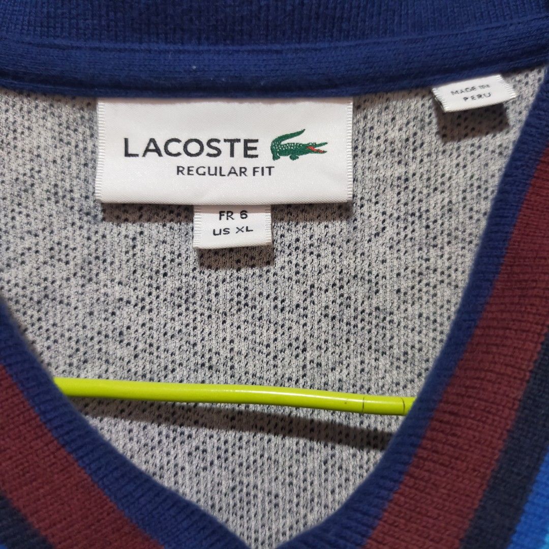 Lacoste Polo Shirt (Category: Tshirts & Polo Shirts ) located in San Fernando. Submitted by graileditemsph (Listing ID 1256719730, Image 3). Description: Lacoste Polo shirt heather gray with multi colored collar Size 6(Xl) 23.5/29 Excellent condition to new.