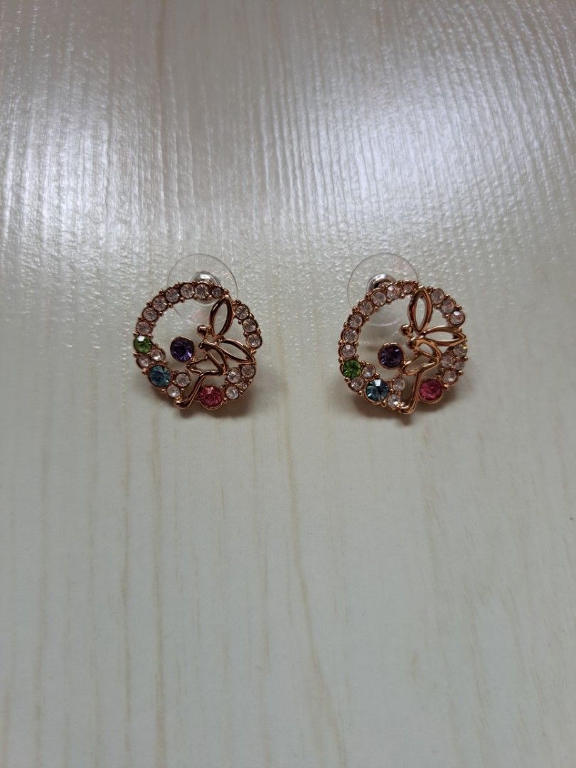 Rainbow coloured earrings top