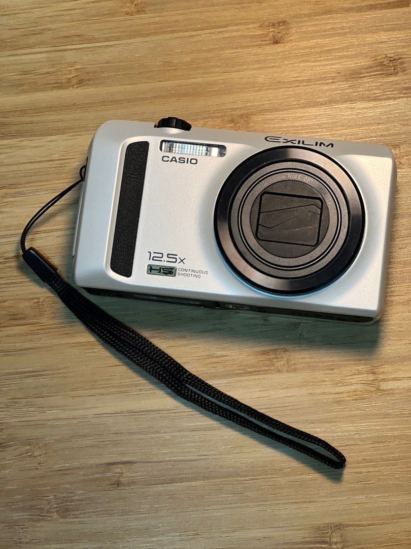 Faulty Casio Exilim ZR100 Digital Camera with battery and charger